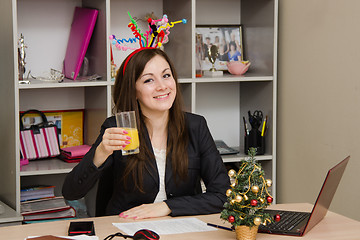 Image showing Girl in the office to celebrate New Year