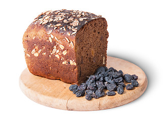 Image showing Unleavened bread with seeds on wooden board with raisins