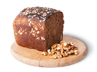 Image showing Unleavened bread with seeds on wooden board with nuts