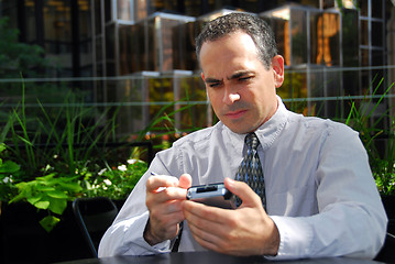 Image showing Businessman pda