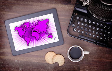 Image showing World map on a tablet