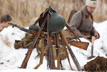 Image showing Few weapons stand togather