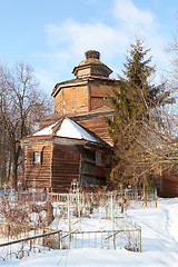 Image showing destroyed old Wooden  church on orthodox cemetery in winter, Russia