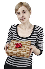 Image showing Young woman holding a present