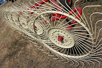 Image showing New hay raker farm equipment. Agricultural machinery