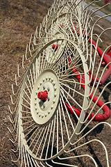 Image showing New hay raker farm equipment. Agricultural machinery