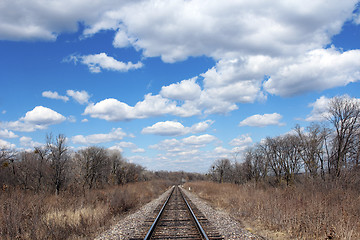 Image showing Railway to horizon and clouds on the sky background.