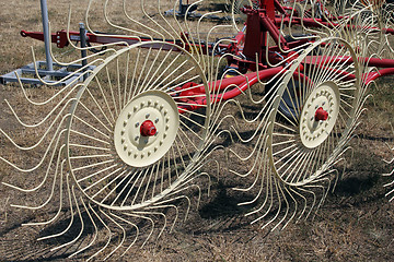 Image showing New hay raker farm equipment. Agricultural machinery