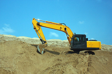 Image showing Yellow excavator, excavation work at a construction site.