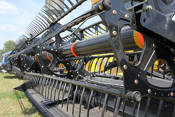 Image showing Closeup of harvesting machinery while working the field.