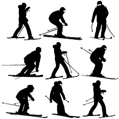 Image showing Mountain skier   men and woman speeding down slope. Vector sport