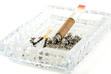 Image showing Cigarette butt with red lipstick in the ashtray.