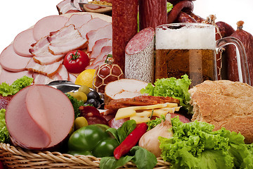 Image showing A composition of meat and vegetables with beer