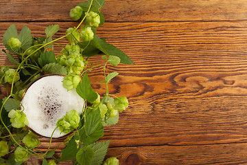 Image showing Pint and hop plant