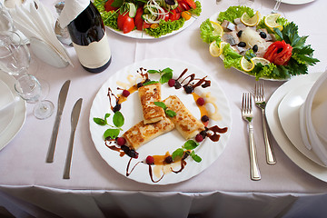 Image showing celebratory table with tasty dishs