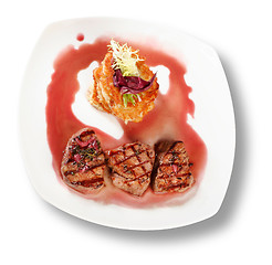 Image showing Veal Medallions with potato pancakes. Closeup. File includes cli