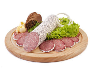 Image showing Sliced sausage with bread, butter and vegetables