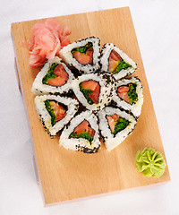 Image showing Sushi rolls with tuna and green onion