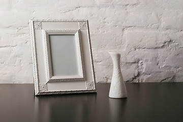 Image showing composition with vintage fotoframe and vase