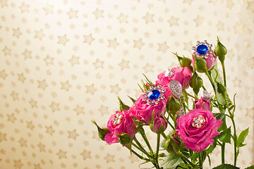 Image showing Pink roses with jewellery