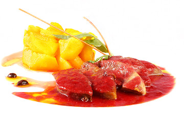 Image showing Pork with cherry sauce and pineapple on white background