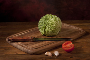 Image showing Green cabbage on wooden tablet