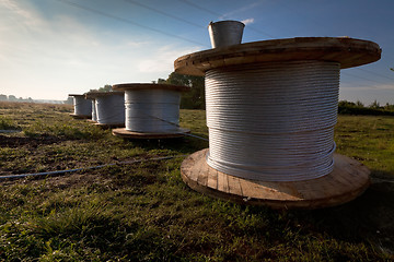 Image showing Bobbins with electric power wire