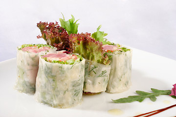 Image showing Image of sushi decorated with lettuce