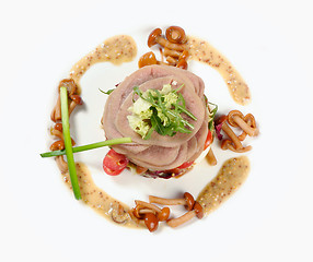 Image showing Smoked tongue served with mushrooms and tomatos