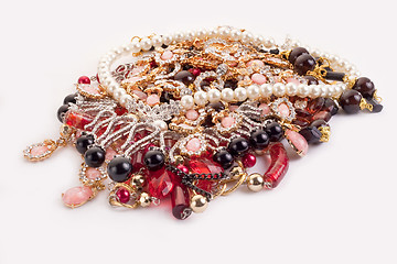 Image showing A pile of colored jewellery on white background