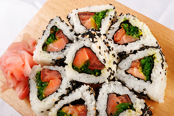 Image showing Sushi rolls with tuna and green onion