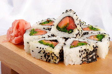 Image showing Sushi rolls with tuna and green onion