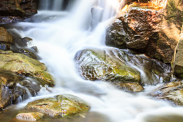 Image showing waterfall and rocks covered with moss