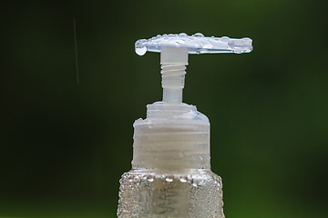 Image showing drop water on pump of bottle