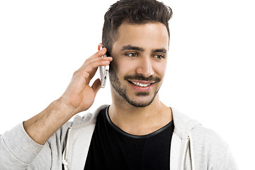 Image showing Young man talking on cell phone