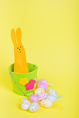 Image showing Easter Bunny in bucket on yellow