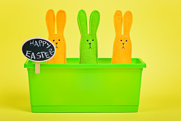 Image showing Easter Bunnies in flower pot with chalkboard