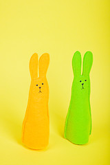 Image showing Two easter Bunnys on yellow