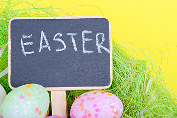 Image showing Miniature chalkboard with easter eggs