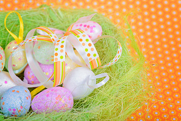 Image showing Easter ribbon and eggs in nest 