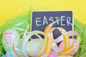 Image showing Easter ribbon with eggs and board