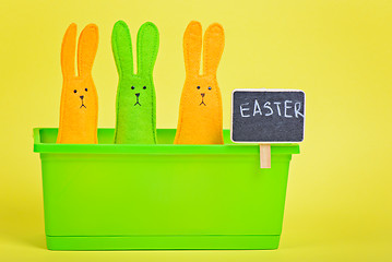 Image showing Easter Bunnies in flower pot with blackboard