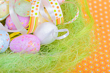 Image showing Easter eggs and ribbon in nest 