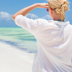 Image showing Woman on the beach in white shirt. 