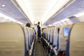 Image showing Stewardess on the airplane.