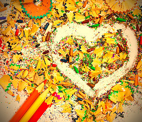 Image showing heart, three pencils and colored wooden shavings