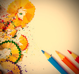 Image showing colored pencils and shavings on white background