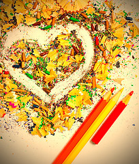 Image showing heart, three pencils and varicolored wooden shavings