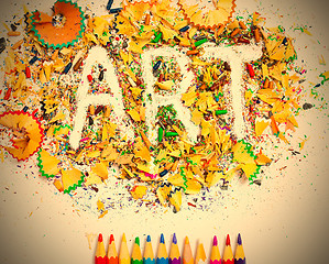 Image showing ART word on the background of colored shavings and pencils