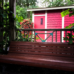 Image showing Little red house decorated with flowers